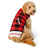 Dog wearing a red and black checkered sweater on a white background