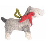 Knitted dog toy with a red bow and green tag on a white background
